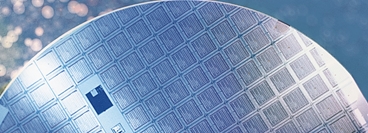 Blue silicon wafer produced in the semiconductor electronics industry